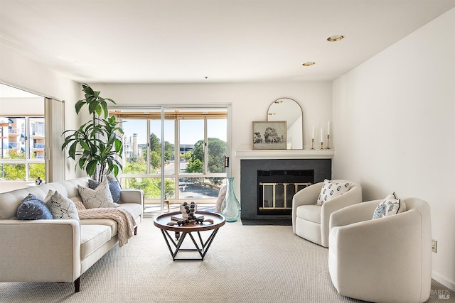 living room with plenty of natural light and carpet floors