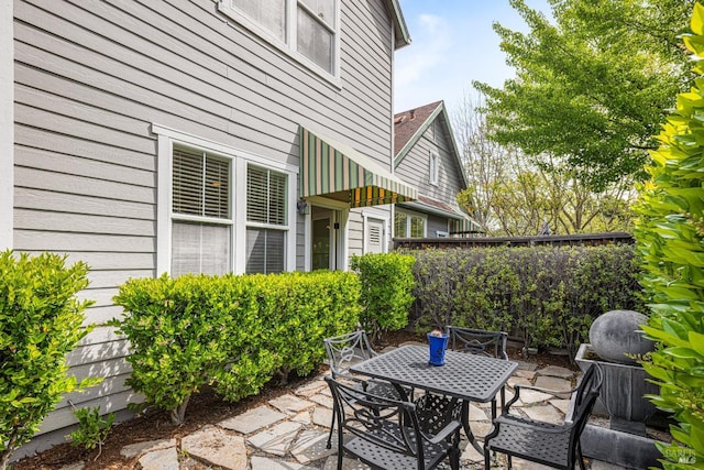 view of patio / terrace featuring outdoor dining area and fence