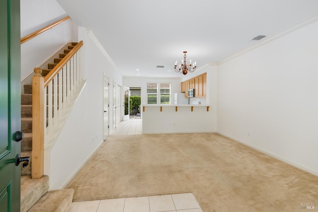 unfurnished living room featuring ornamental molding, light colored carpet, stairway, and an inviting chandelier