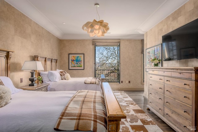 bedroom with dark hardwood / wood-style floors