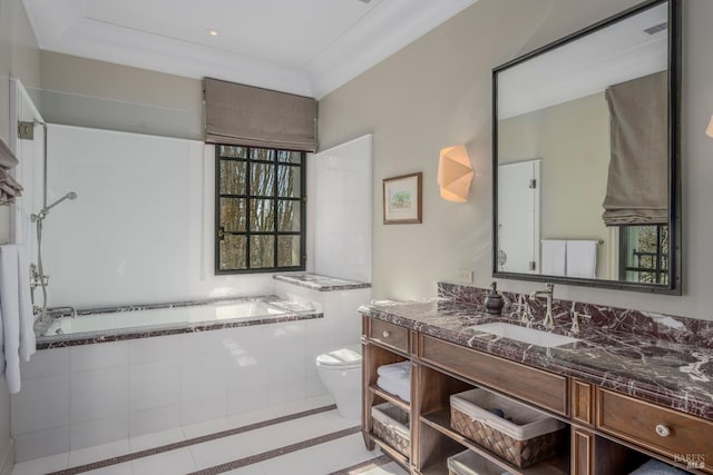 bathroom featuring tile floors, a relaxing tiled bath, vanity, and toilet