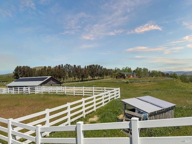 view of yard with a rural view