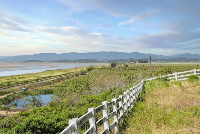 view of mountain feature featuring a rural view and a water view