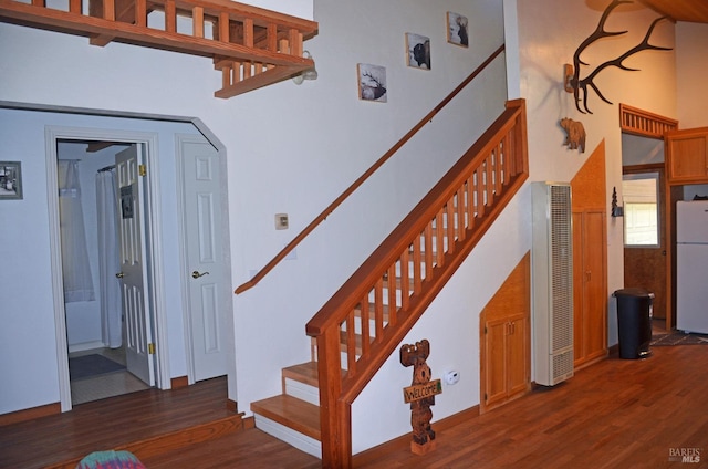 stairway featuring dark hardwood / wood-style flooring