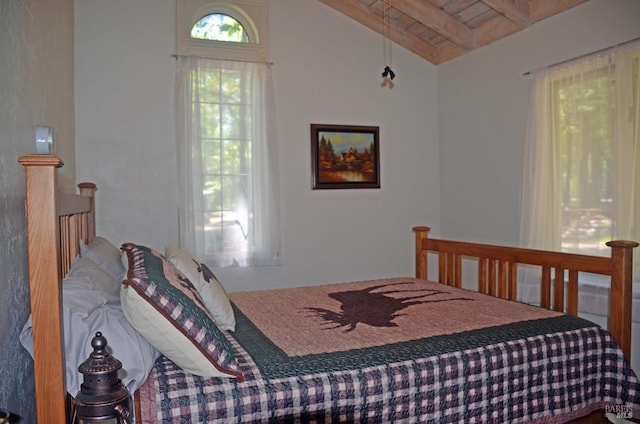 bedroom featuring wood ceiling and vaulted ceiling with beams