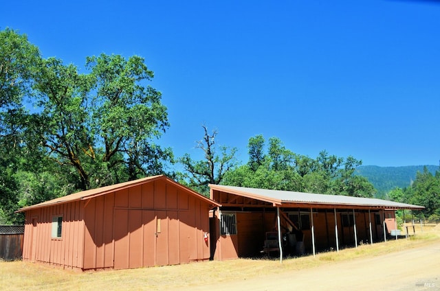 view of horse barn featuring an outdoor structure