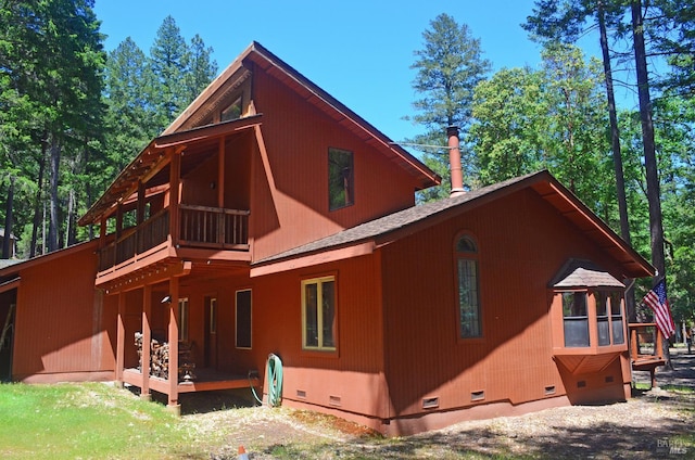 view of home's exterior featuring a balcony