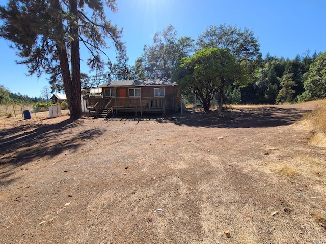 view of yard featuring a wooden deck