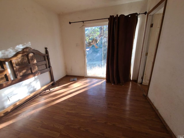 empty room with wood-type flooring