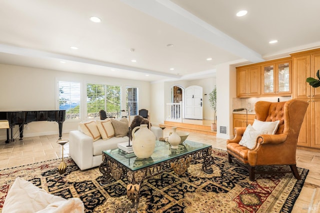 living room featuring beam ceiling