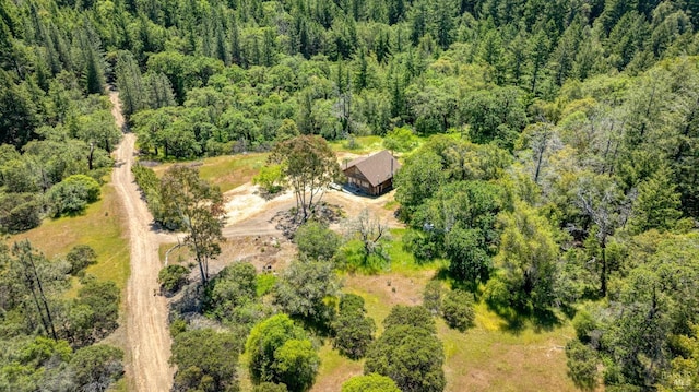 bird's eye view featuring a forest view