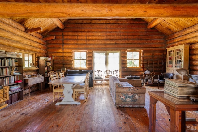 living area featuring beam ceiling, a wealth of natural light, wood ceiling, and wood-type flooring