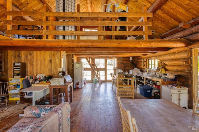 misc room featuring wooden ceiling, high vaulted ceiling, wood-type flooring, rustic walls, and beamed ceiling