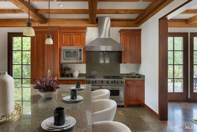 kitchen featuring wall chimney range hood, coffered ceiling, beam ceiling, and appliances with stainless steel finishes