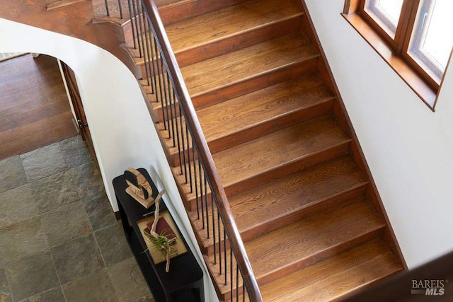 stairway with tile flooring