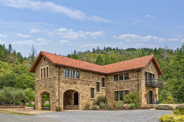 view of front of property with a balcony