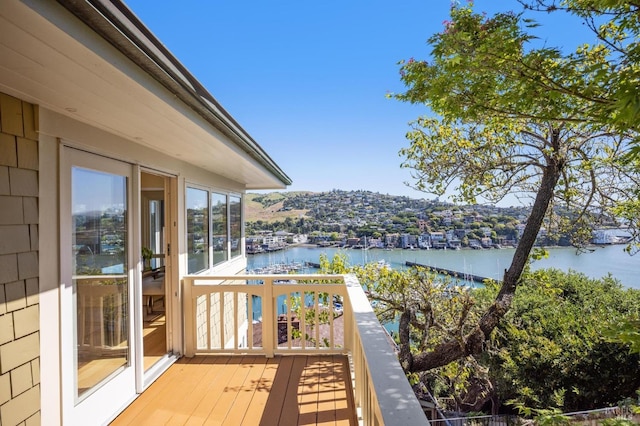 wooden deck featuring a water view