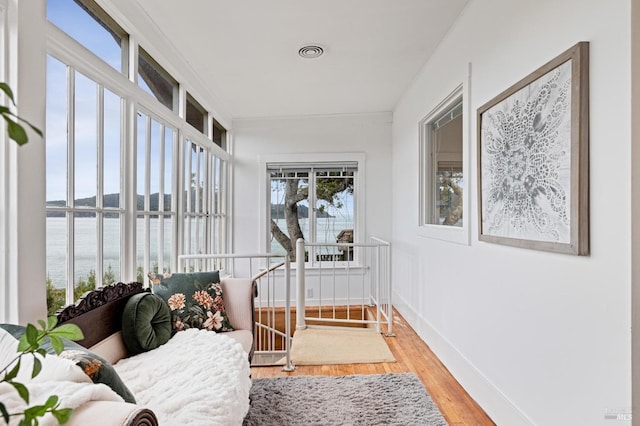 sunroom / solarium with a water view