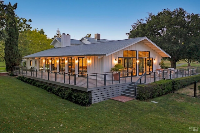 view of back house at dusk