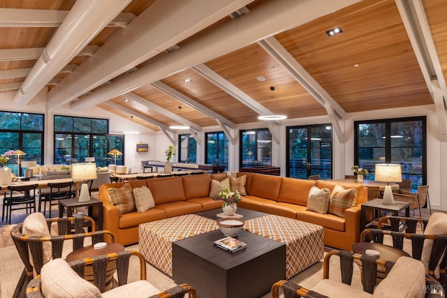 living room with lofted ceiling with beams and wooden ceiling