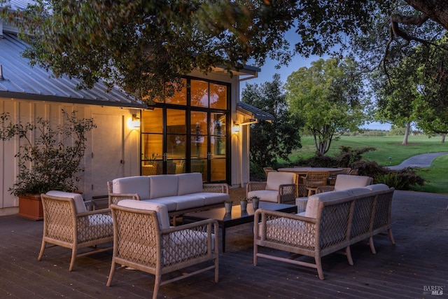 wooden terrace featuring an outdoor living space