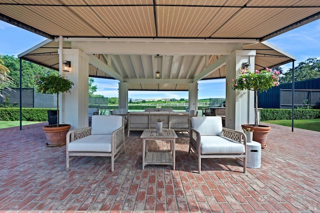 view of patio / terrace with an outdoor living space and a gazebo