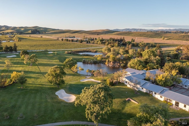 birds eye view of property with a rural view and a water and mountain view