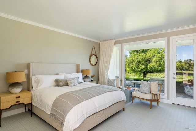 bedroom with ornamental molding, carpet, and access to exterior