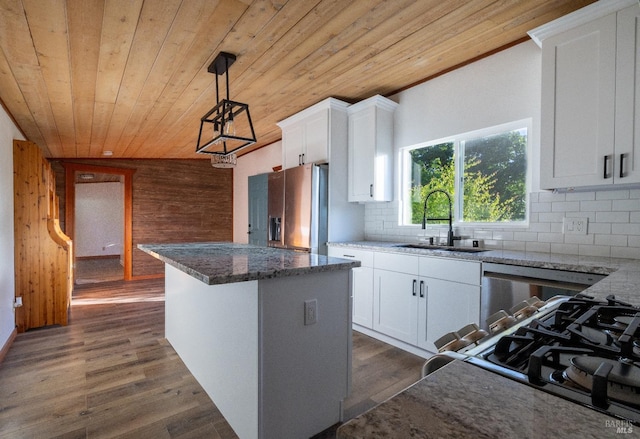 kitchen with a kitchen island, dark wood-style flooring, a sink, wood ceiling, and backsplash