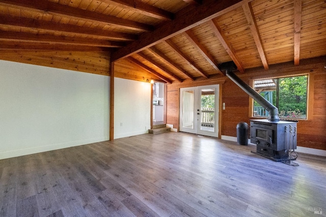 unfurnished living room with a wood stove, vaulted ceiling with beams, dark wood-style flooring, wood ceiling, and french doors