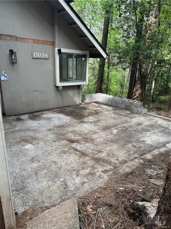 view of property exterior featuring a patio