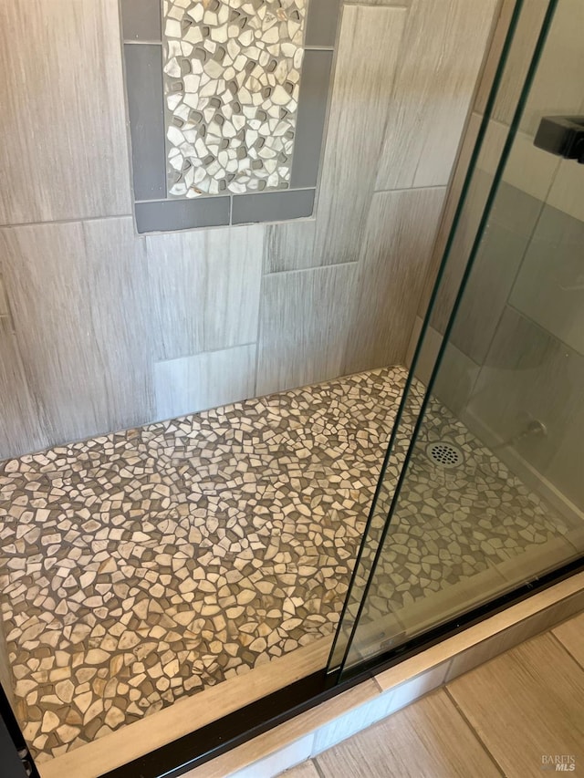 bathroom featuring an enclosed shower