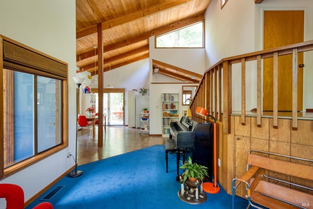 foyer entrance with beamed ceiling, high vaulted ceiling, and wood ceiling