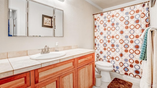 bathroom featuring tile floors, crown molding, toilet, and vanity