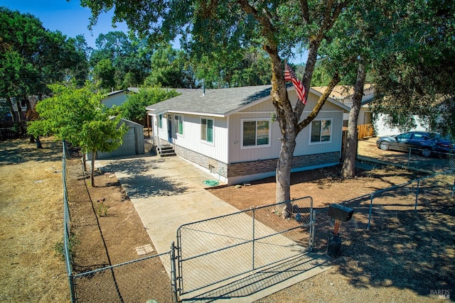 view of front of property featuring an outbuilding and a garage