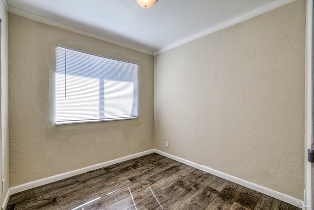 unfurnished room featuring ornamental molding and hardwood / wood-style flooring