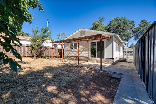 back of house with a patio area