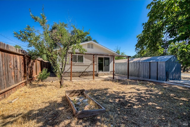 view of yard featuring a patio area and a shed