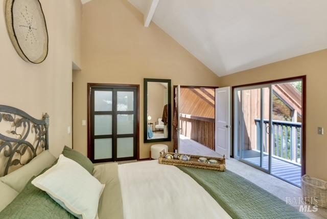 carpeted bedroom with access to exterior, high vaulted ceiling, and beam ceiling