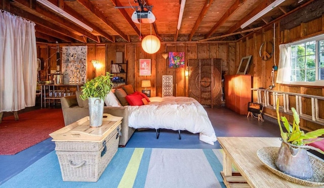 bedroom with beamed ceiling and wooden walls