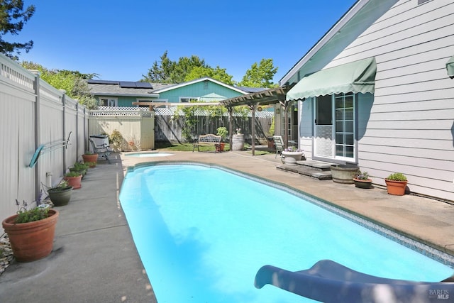 view of swimming pool with a pergola and a patio area