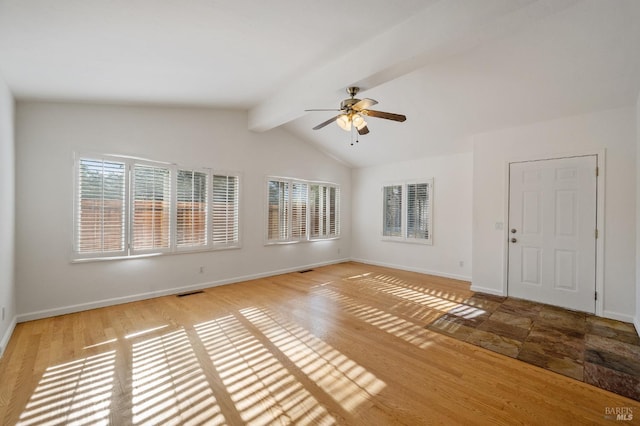 tiled empty room with vaulted ceiling with beams and ceiling fan