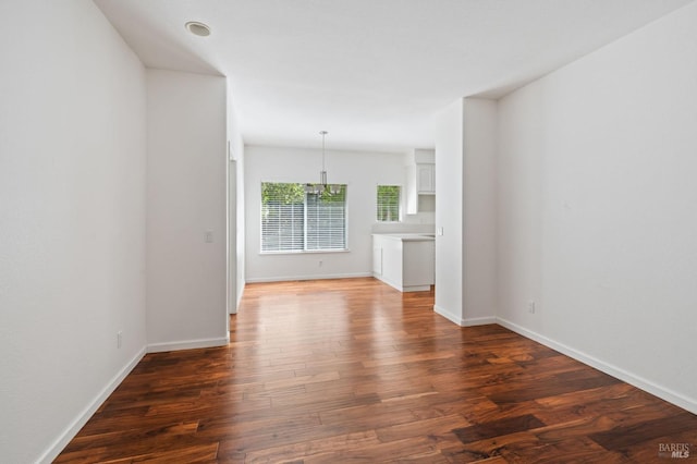 unfurnished living room with hardwood / wood-style flooring