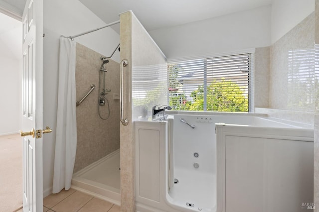 bathroom featuring tile floors and a shower with shower curtain