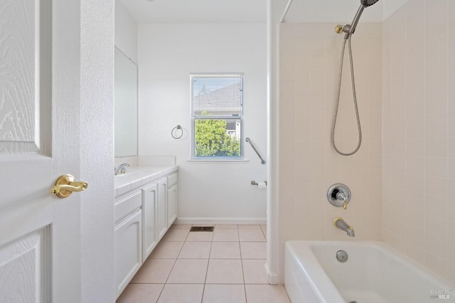 bathroom featuring tile flooring, vanity, and tiled shower / bath combo