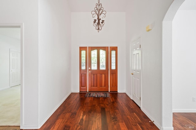 view of carpeted foyer entrance