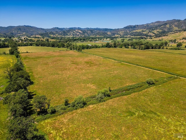 aerial view featuring a mountain view and a rural view