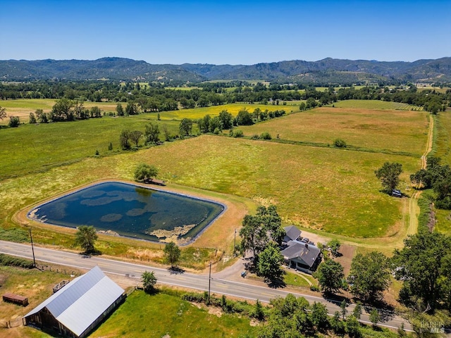 aerial view with a mountain view and a rural view