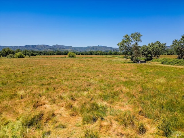 property view of mountains featuring a rural view