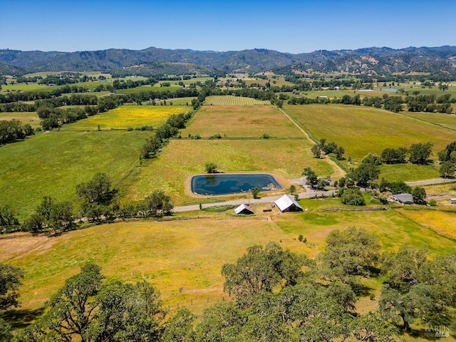 aerial view with a mountain view and a rural view